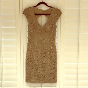 Gold backless dress by Sue Wong.